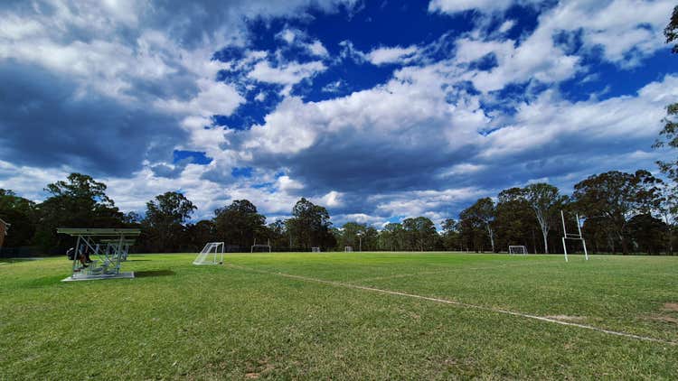 Sports fields with grandstands, soccer goals